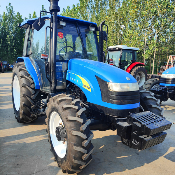 used New Holland 1004 tractor front ballast and dry land tyres